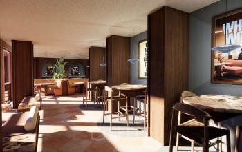 Modern lounge area at Coolsingel 139 in Rotterdam Center, featuring stylish tables and chairs, ideal for meetings or breaks. Perfect space for office space rental.