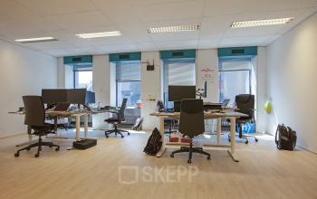 Modern office space rental at Westblaak 92, Rotterdam Center, with equipped desks and bright lighting.