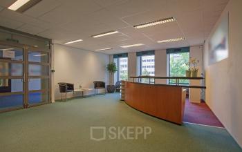 Spacious office space rental at Westblaak 92, Rotterdam Center, with a well-lit reception area and comfortable seating.