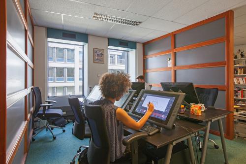 Professional office space rental at Westblaak 92, Rotterdam Center with employees working diligently at their desks.