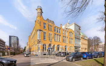 Exterior view of a historic office building at Veerhaven 7, Rotterdam Center, suitable for office space rental with available parking.