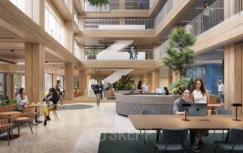 Spacious office interior at Coolsingel 75, Rotterdam Center, featuring an open floorplan with people working and networking. Ideal for those seeking office space rental opportunities.