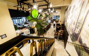 Modern office interior at Coolsingel 104, Rotterdam Center, with open workspaces and a stylish lounge area.