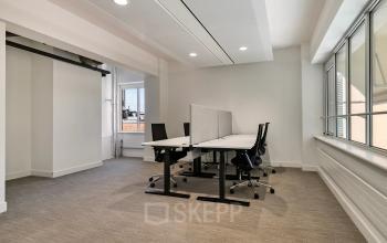 Bright, modern office space at Coolsingel 104, in Rotterdam Center, perfect for rent. Features natural light and sleek furnishings ideal for productive work sessions.