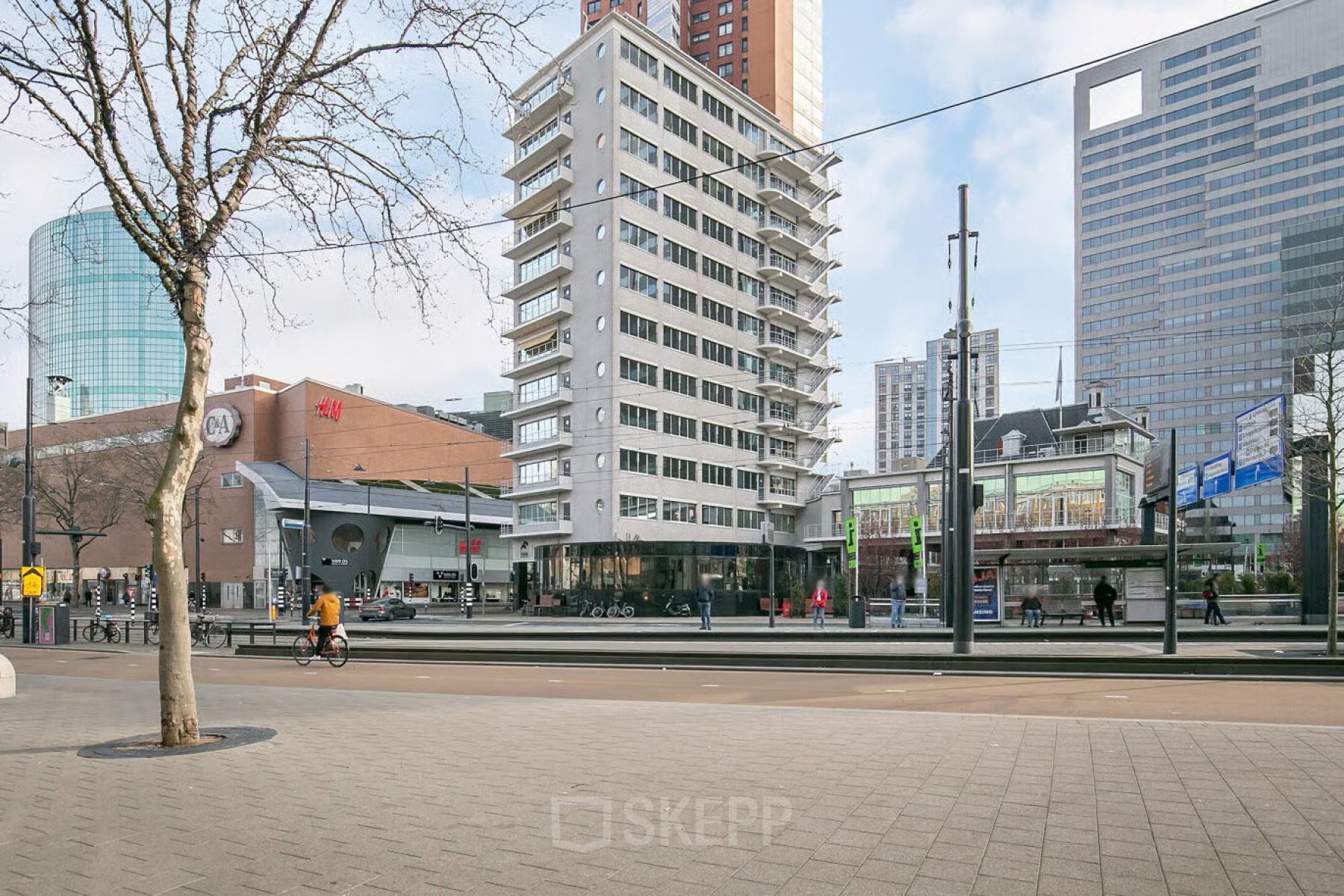 View of Coolsingel 104, Rotterdam Center showing surrounding business buildings, ideal for office space rental.