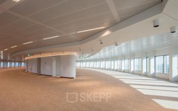 Spacious, modern office space rental at Beursplein 37, Rotterdam Center with plenty of natural light and fitted with contemporary ceiling lights.