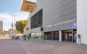 Exterior view of office building at Lloydstraat 21 B, Rotterdam Delfshaven, featuring accessible parking. Ideal location for those seeking office space rental.