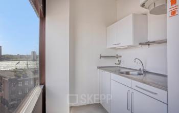 Bright pantry area in office space for rent at Kratonkade 7 - 27, Rotterdam Delfshaven, with a view of the river.