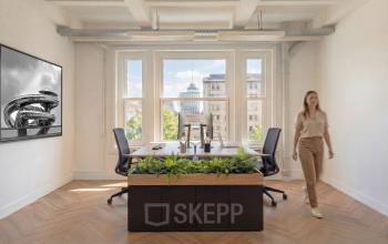Bright office space at Lloydstraat 5, Rotterdam Delfshaven, featuring desks and ergonomic chairs with a view. Rent office space in this inviting environment.