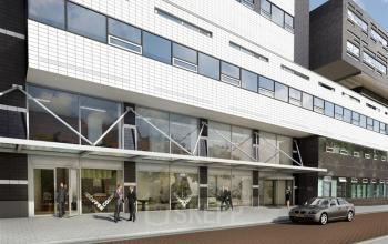 Exterior view of office to rent at Westerlaan 10-65, Rotterdam Delfshaven, Rotterdam, showing the modern glass facade with people walking by.