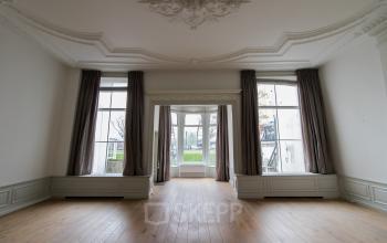 Spacious office space with large windows and classic detailing at Haringvliet 92, Rotterdam Haringvliet. Ideal for office space rental, offering abundant natural light and a blank canvas for customization.