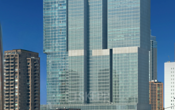 Exterior view of modern office building located at Wilhelminakade 173, Rotterdam Kop van Zuid, featuring glass facades, ideal for rent office space.