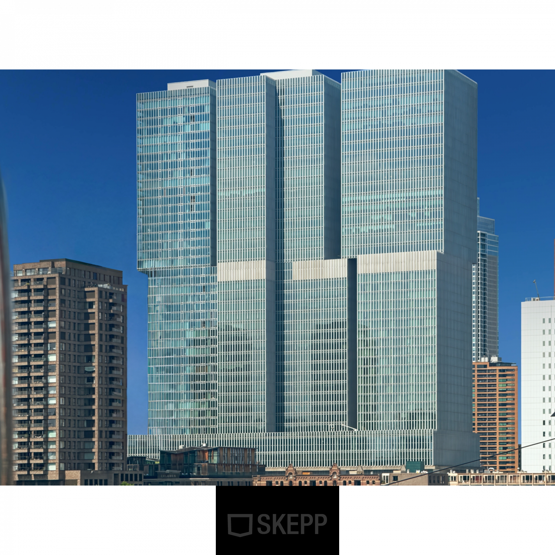 Exterior view of modern office building located at Wilhelminakade 173, Rotterdam Kop van Zuid, featuring glass facades, ideal for rent office space.