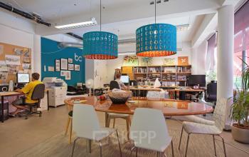 Interior office space at Vijverhofstraat 47, Rotterdam North, with modern furnishings and people working at desks.