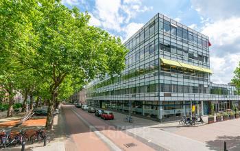 Exterior view of a modern glass office building located at Vijverhofstraat 47, Rotterdam North, Rotterdam, suitable for office space rental.