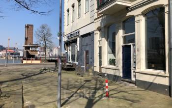 Bright and modern exterior view of office space rental at Van der Takstraat 8, Rotterdam Noordereiland with a clear sky.