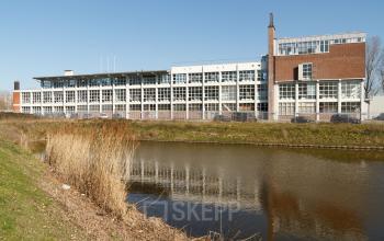 Exterior view of office building located at Overschieseweg 34, Schiedam, available for office space rental.