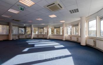 Bright office space in Schiedam with large windows and ample natural light, ideal for office space rental.