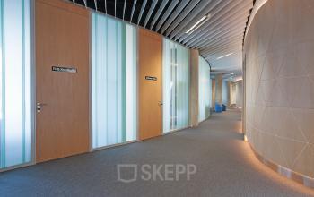 Sleek hallway in Evert van de Beekstraat 104, Schiphol with modern design elements, ideal for businesses looking for a professional office space rental.