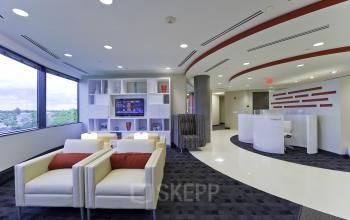 Modern lounge area with white armchairs and a view of green landscape, located at Evert van de Beekstraat 310***, Schiphol Airport. Ideal for office space rental.