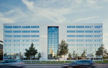 Exterior of an office building located at Evert van de Beekstraat 310, Schiphol Airport, Schiphol. The structure features a modern glass facade and multiple floors available for office space rental.