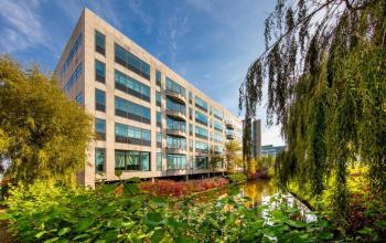 Exterior view of Beechavenue 54-62 office building in Schiphol Rijk, Schiphol, showcasing modern architecture and lush surroundings. Ideal for office space rental.