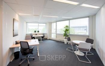 Bright office space rental at Beechavenue 54-62 in Schiphol, featuring modern furniture and ample natural light.