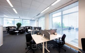 Modern Beechavenue 54-62 office space rental in Schiphol featuring clean workstations bathed in natural light.