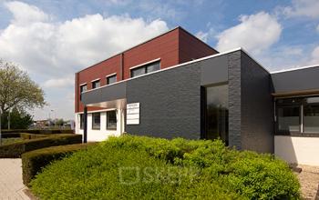 Exterior view of Nusterweg 63, Sittard, showcasing a modern office building available for rent. Ideal for office space rental.