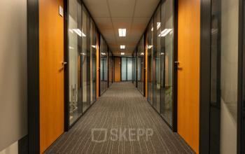 Hallway at Curieweg 9, Spijkenisse, featuring several office doors ideal for office space rental.