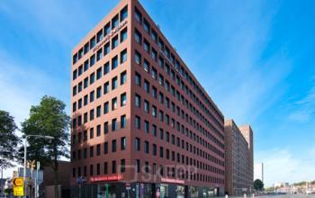 Exterior view of the office building located at Hart van Brabantlaan 12-16, in Tilburg. The building has a modern design suitable for office space rental.