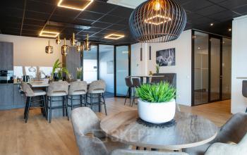 Modern office space at Kapitein Rondairestraat 8, Tilburg featuring stylish furniture, bright lighting, and a welcoming atmosphere, ideal for office space rental.