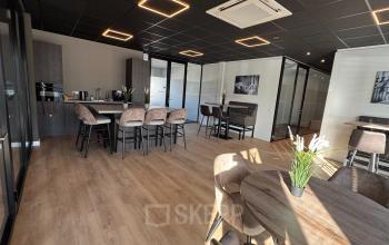 Interior view of a furnished office space at Kapitein Rondairestraat 8, Tilburg, featuring modern seating and tables, suitable for office space rental or offices to rent.