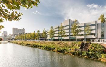 Exterior view of an office building at Daalsesingel 51, near Utrecht Central Station, ideal for office space rental with scenic canal-side location.