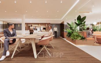 Modern workspace at Moreelsepark 1 in Utrecht Central Station featuring polished wooden floors, contemporary seating, and vibrant plants, perfect for those seeking office space rental. Several professionals engaged in business activities.