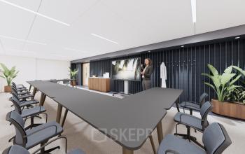 Modern conference room in Utrecht Central Station's office at Moreelsepark 1, featuring a large U-shaped table, comfortable chairs, flat screen for presentations, and green plants enhancing a professional atmosphere. Ideal for office space rental.