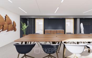 Modern meeting room at Moreelsepark 1, Utrecht Central Station, featuring a wooden table, sleek chairs, and contemporary wall art. Ideal for office space rental.