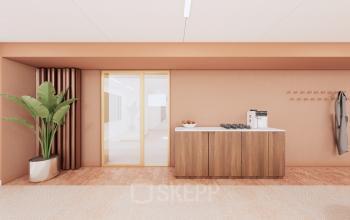 Modern office space with a wooden cabinet and a coffee machine, located at Moreelsepark 1, Utrecht Central Station. Ideal for office space rental.