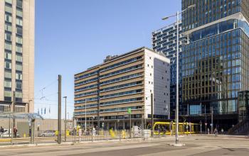 Exterior view of an office building at Jaarbeursplein 22, Utrecht Central Station, showcasing modern architecture ideal for rent office space.