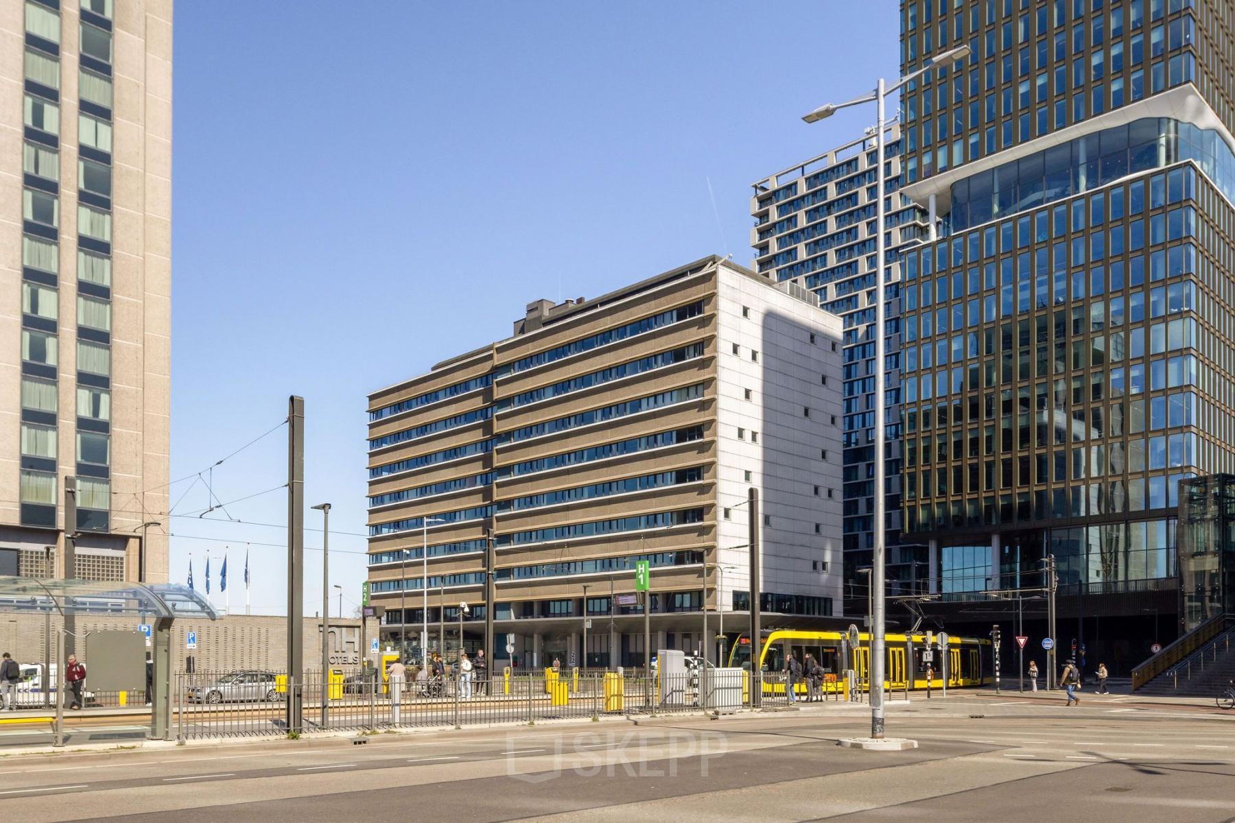 Exterior view of an office building at Jaarbeursplein 22, Utrecht Central Station, showcasing modern architecture ideal for rent office space.
