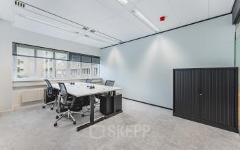 Bright office space with desks and chairs available for rent at Leidseveer 2-10, near Utrecht Central Station.
