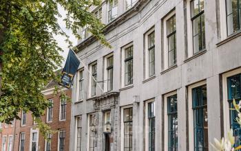 Exterior view of office building at Kromme Nieuwegracht 3, Utrecht Center. Historical architecture by a canal, office space rental available.