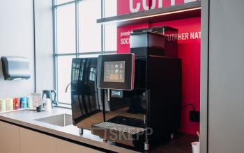Modern pantry in an office space available for rent at Kromme Nieuwegracht 3, Utrecht Center, Utrecht, featuring a coffee machine and sink.