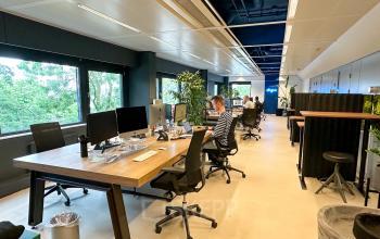 Modern furnished office space to rent at Bernadottelaan 13, Utrecht Kanaleneiland with people working at desks and using computers.