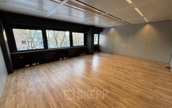 Spacious office to rent at Bernadottelaan 13, Utrecht Kanaleneiland with large windows and wooden flooring, perfect for flexible office space rental opportunities.