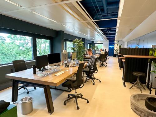 Modern furnished office space to rent at Bernadottelaan 13, Utrecht Kanaleneiland with people working at desks and using computers.