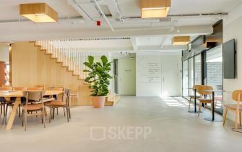 Bright and inviting space at Europalaan 93, Utrecht Kanaleneiland, featuring modern furnishings, ample natural light, and plant decor, ideal for office space rental.