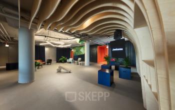 Modern office interior at Europalaan 100, Utrecht Kanaleneiland, with unique ceiling design and contemporary furnished workspaces highlighting office space rental.