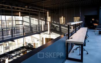 Spacious office to rent at Atoomweg 63, Utrecht Lage Weide, featuring modern workspaces with ample natural light and furnishings.