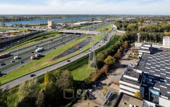 Aerial view of Utrecht Lage Weide, featuring Zonnebaan 45 amid an expanse of roads and greenery, ideal for office space rental.